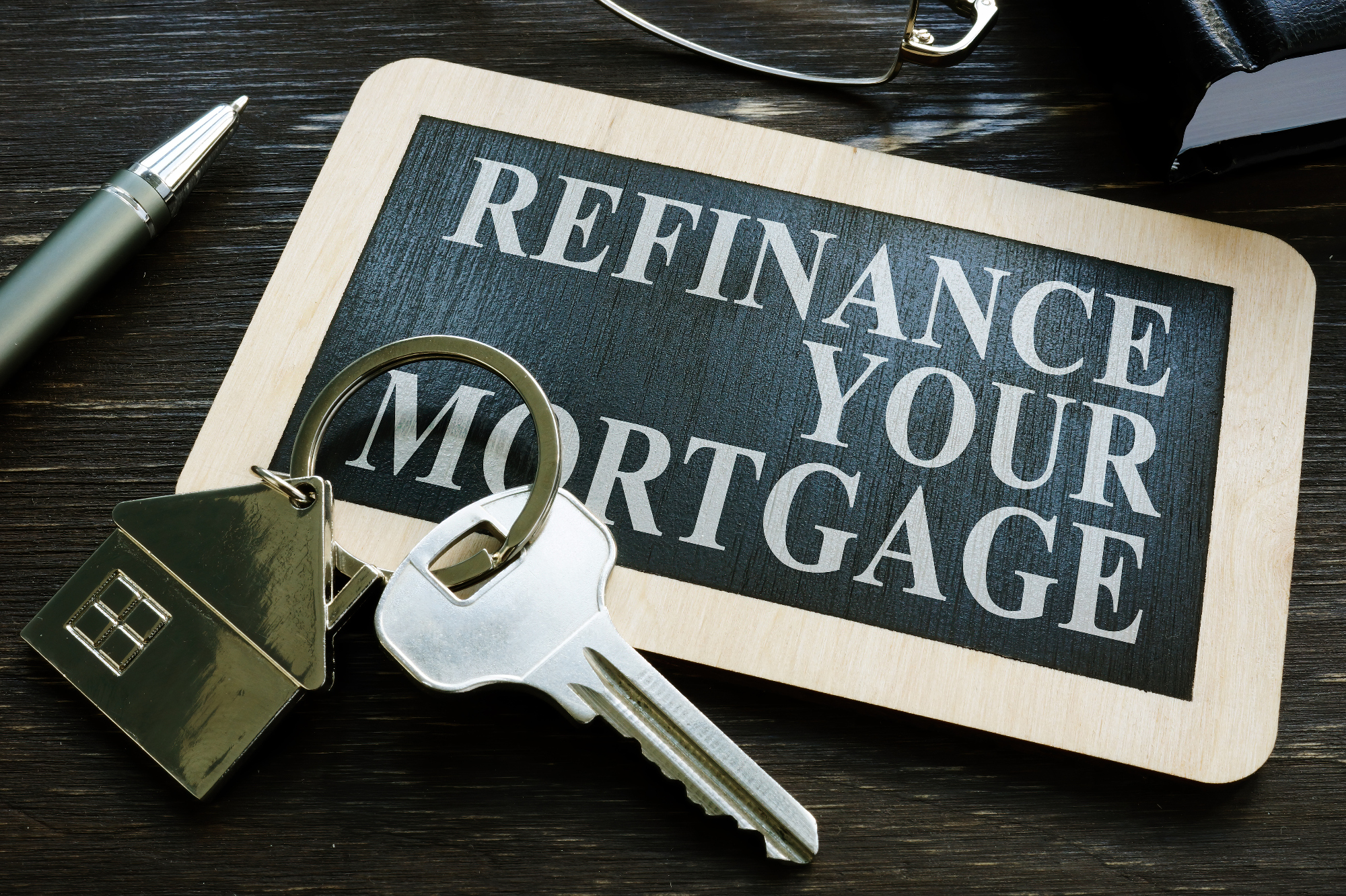 Refinance your mortgage word on the small blackboard.